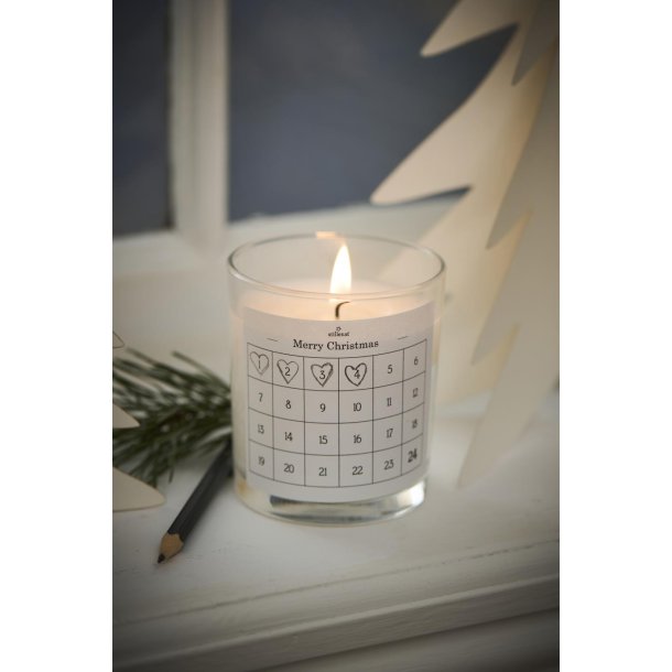 Kalenderlys <br><br> Glas med paraffinlys <br><br> etiket m/ 1-24 <br><br> ca. 35t  <br><br>