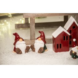 Julemand <br><br> siddende med gr�n tr�je <br><br> 10 cm <br><br> 